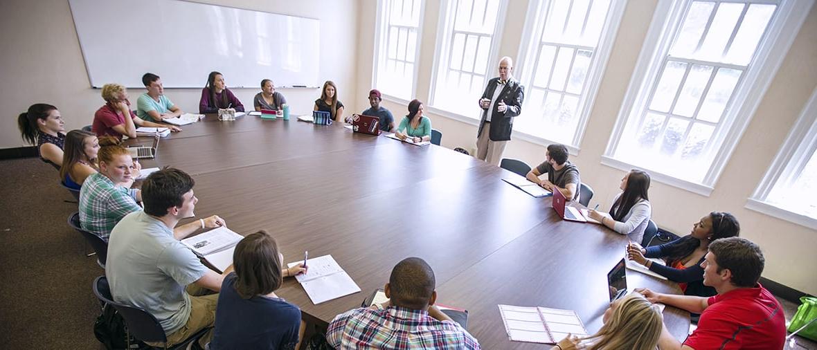 Several students at large round table